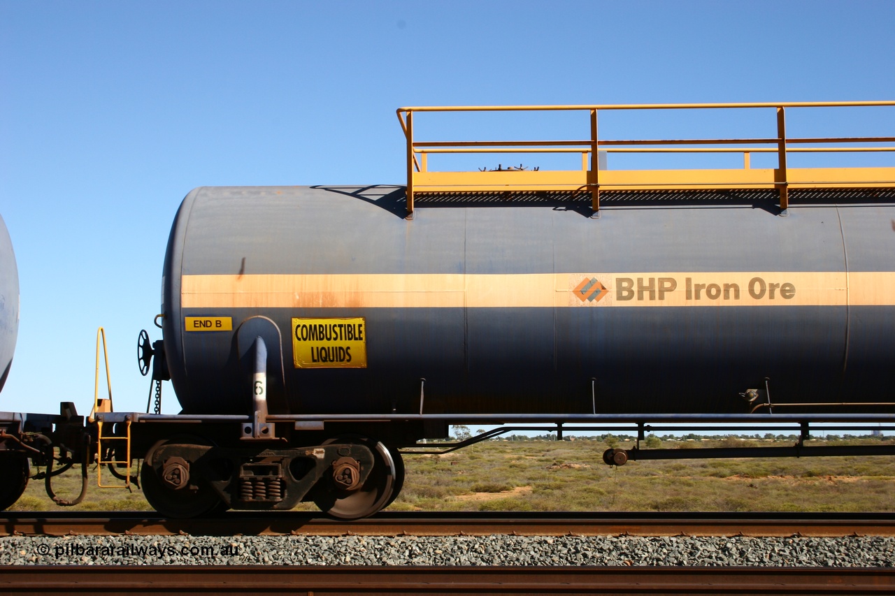 050704 3994
Bing Siding, empty 116 kL Comeng WA built tank waggon 0016 from 1974-5, one of six such tank waggons, detail of A end and bogie.
Keywords: Comeng-WA;BHP-tank-waggon;