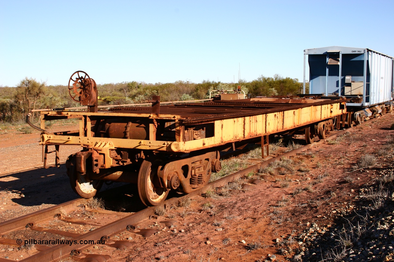 050713 4102
Flash Butt yard, heavily stripped down riveted waggon 206, possible original ballast waggon, number 206 was originally a waggon in the 'Camp Train' and appears to have USA origin, 3/4 view from handbrake end.
Keywords: BHP-flat-waggon;