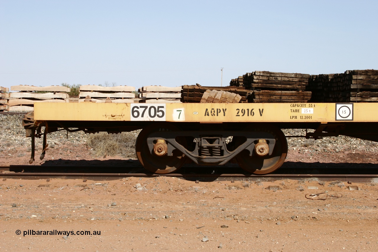 051001 5621
Flash Butt yard, BHP flat waggon 6705 with EDI decal and ROA code of AQPY 2916, 55 tonne capacity, unsure of original owner, possible AN AOOX, then cut down to the Pilbara through CFCLA.
Keywords: 6705;AQPY-type;AQPY2916;CFCLA;BHP-flat-waggon;