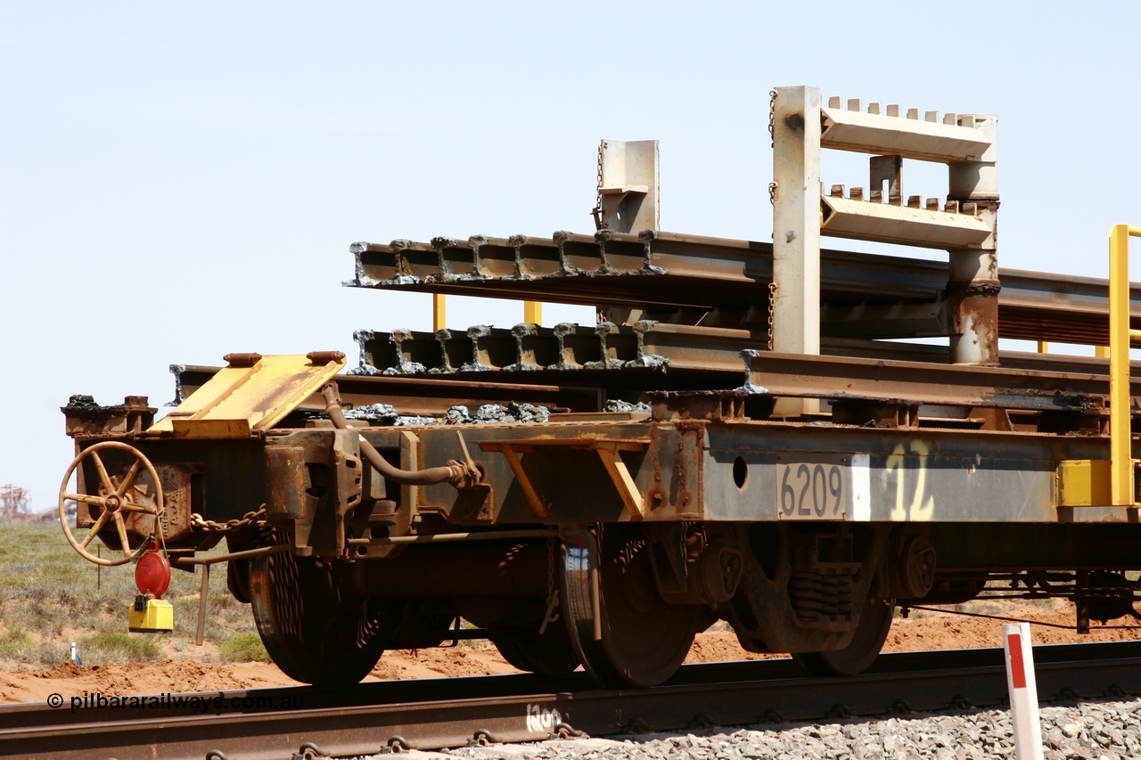 051001 5683
Boodarie, the Steel Train or rail recovery and transport train, hand brake end of waggon #12, 6209, a Comeng WA built flat waggon from January 1977 under order no. 07-M-282 RY.
Keywords: Comeng-WA;BHP-rail-train;