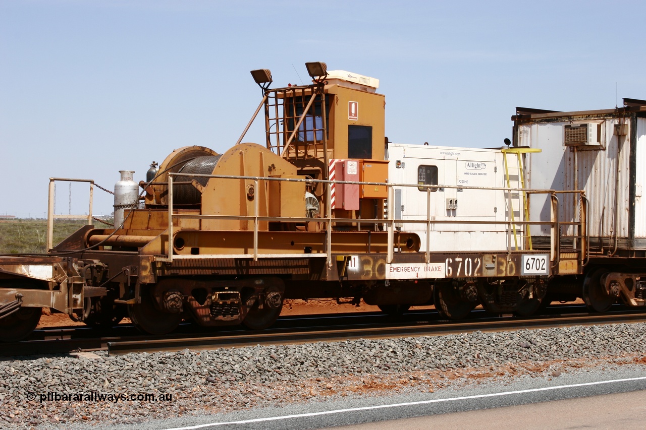 051001 5727
Boodarie, the Steel Train or rail recovery and transport train, flat waggon #30, 6702, heavily cut down and modified Magor USA ore waggon by Mt Newman Mining workshops, converted to a 50 tonne waggon and designated the winch waggon with generator set to power the winch and the crib car.
Keywords: Magor-USA;Mt-Newman-Mining-WS;BHP-rail-train;