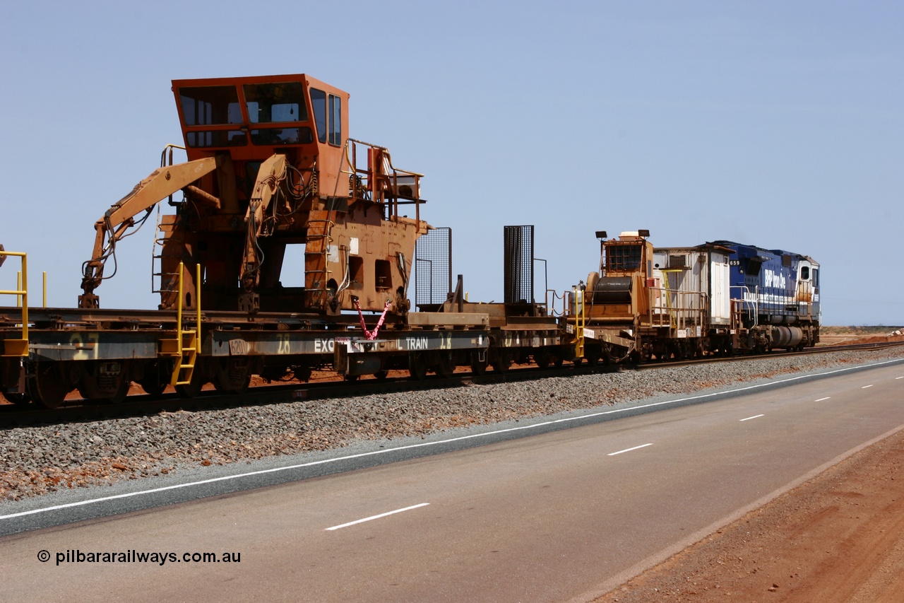 051001 5732
Boodarie, the Steel Train or rail recovery and transport train, flat waggon #28, 2nd lead off waggon 6201, built by Comeng WA in January 1977 under order no. 07-M-282 RY, with the Gemco built straddle crane.
Keywords: Comeng-WA;BHP-rail-train;
