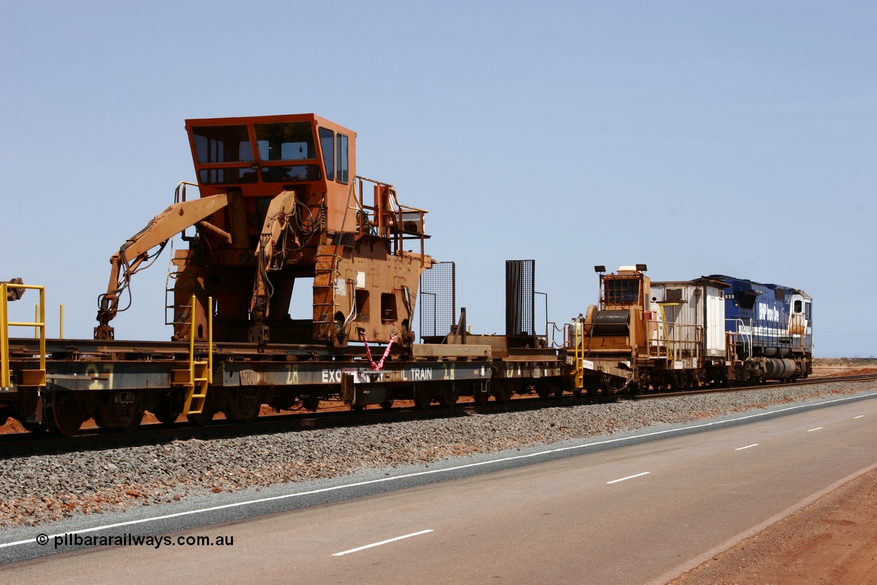 051001 5733
Boodarie, the Steel Train or rail recovery and transport train, flat waggon #28, 2nd lead off waggon 6201, built by Comeng WA in January 1977 under order no. 07-M-282 RY, with the Gemco built straddle crane.
Keywords: Comeng-WA;BHP-rail-train;