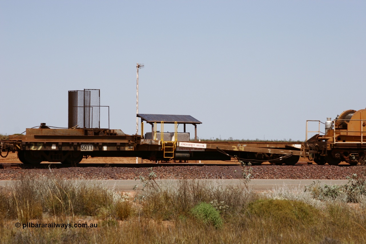 051001 5738
Boodarie, the Steel Train or rail recovery and transport train, 1st lead off waggon 6011, built by Scotts of Ipswich 04-09-1970, the mesh guarding is for the winch cable. The chute arrangement for the discharging and recovery of rail is visible.
Keywords: Scotts-Qld;BHP-rail-train;