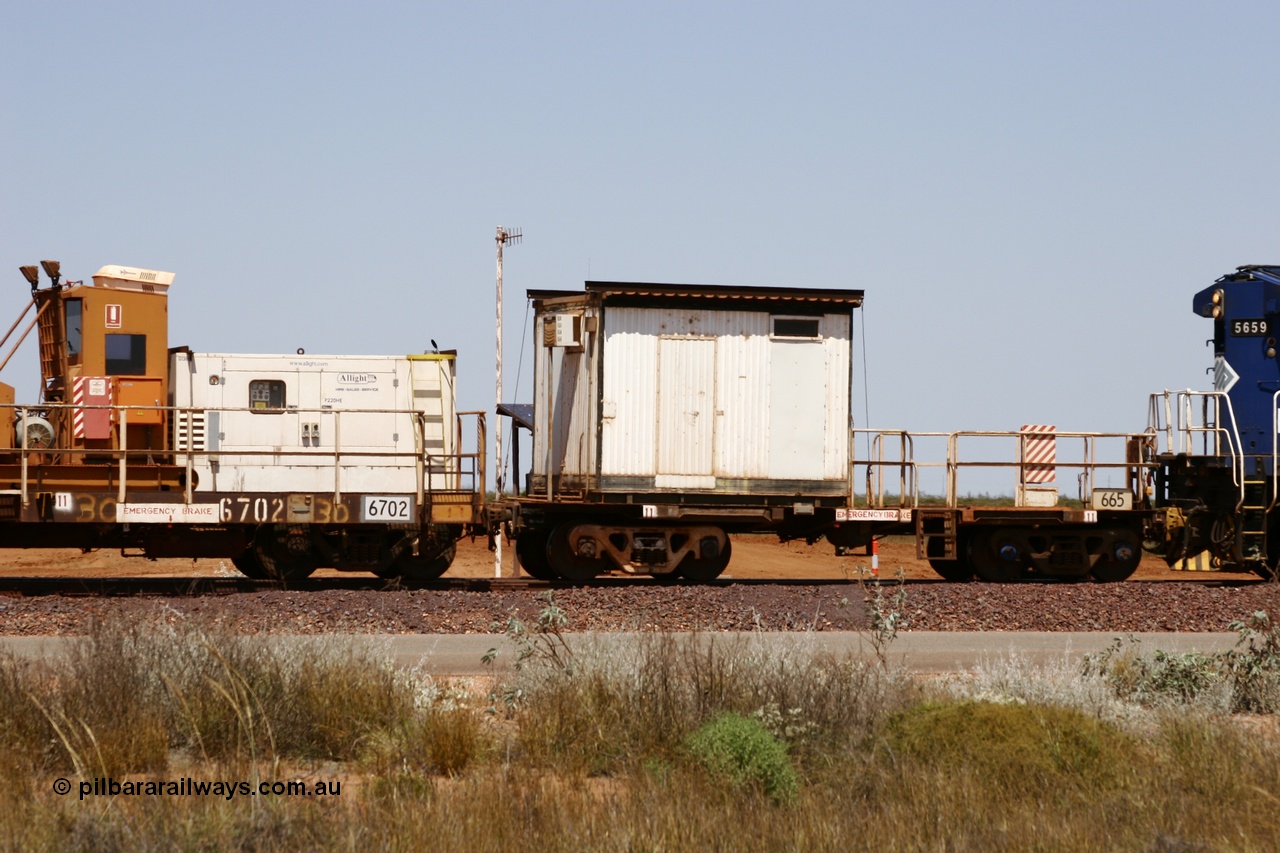 051001 5740
Boodarie, the Steel Train or rail recovery and transport train, cut down by Mt Newman Mining workshops, a Magor USA built former Oroville Dam 91 ton ore waggon 665, seen here being used as the crib waggon on the end of the steel train.
Keywords: Magor-USA;BHP-rail-train;