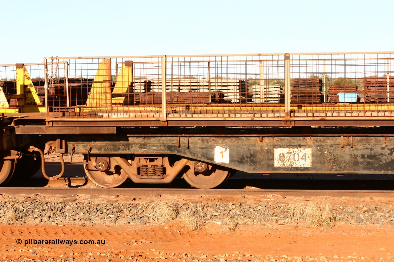 060429 3742
Flash Butt yard, Pony re-laying waggon 6704 flat waggon, unsure of history or who built it or where it came from, it looks to be heavy duty with riveted side frames and an odd handbrake arrangement.
Keywords: BHP-pony-waggon;