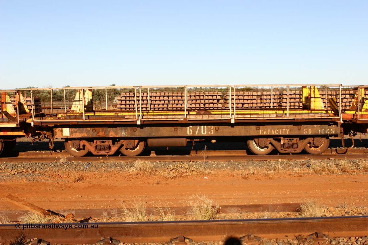 060429 3749
Flash Butt yard, Pony re-laying waggon 6703 is a heavily cut down and modified Magor USA ore waggon done by Mt Newman Mining workshops, converted to a 50 tonne flat waggon.
Keywords: BHP-pony-waggon;Magor-USA;Mt-Newman-Mining-WS;