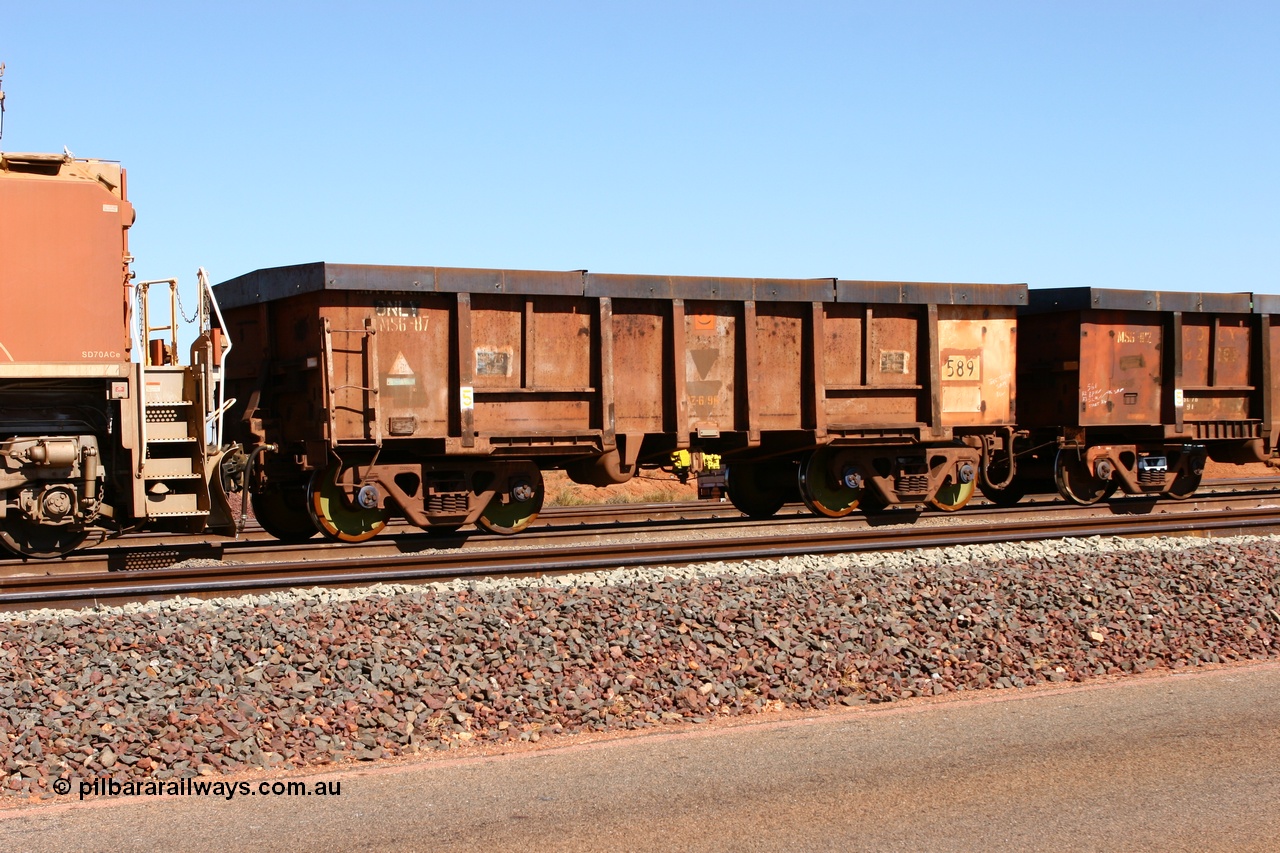 060710 6301
Boodarie Yard, modified original Magor USA built Oroville waggon 589, cut down and covered and in use as indexing waggons on the front of each rake for Finucane Island car dumpers, note the original ODCX marking visible.
Keywords: Magor-USA;Oroville;BHP-index-waggon;
