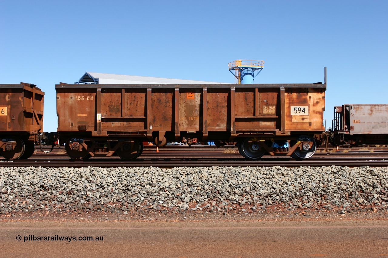 060713 6547
Boodarie Yard, modified original Magor USA built Oroville waggon 594, cut down and covered and in use as indexing waggons on the front of each rake for Finucane Island car dumpers, note the original ODCX marking visible.
Keywords: Magor-USA;Oroville;BHP-index-waggon;