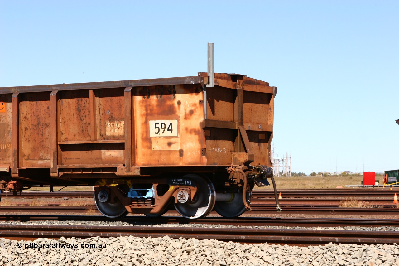 060713 6549
Boodarie Yard, modified original Magor USA built Oroville waggon 594, cut down and covered and in use as indexing waggons on the front of each rake for Finucane Island car dumpers, note the original ODCX marking visible.
Keywords: Magor-USA;Oroville;BHP-index-waggon;
