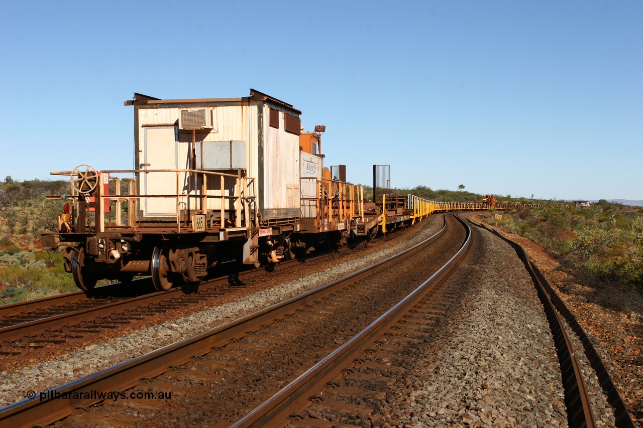 060714 6815
Hesta Siding, view from the rear of the rail recovery and transport train as it snakes around the curves. Crib waggon 665 a former Magor USA built ore waggon, heavily modified by Mt Newman Mining workshops and fitted with an ATCO donga.
Keywords: Mt-Newman-Mining-WS;Magor-USA;BHP-rail-train;