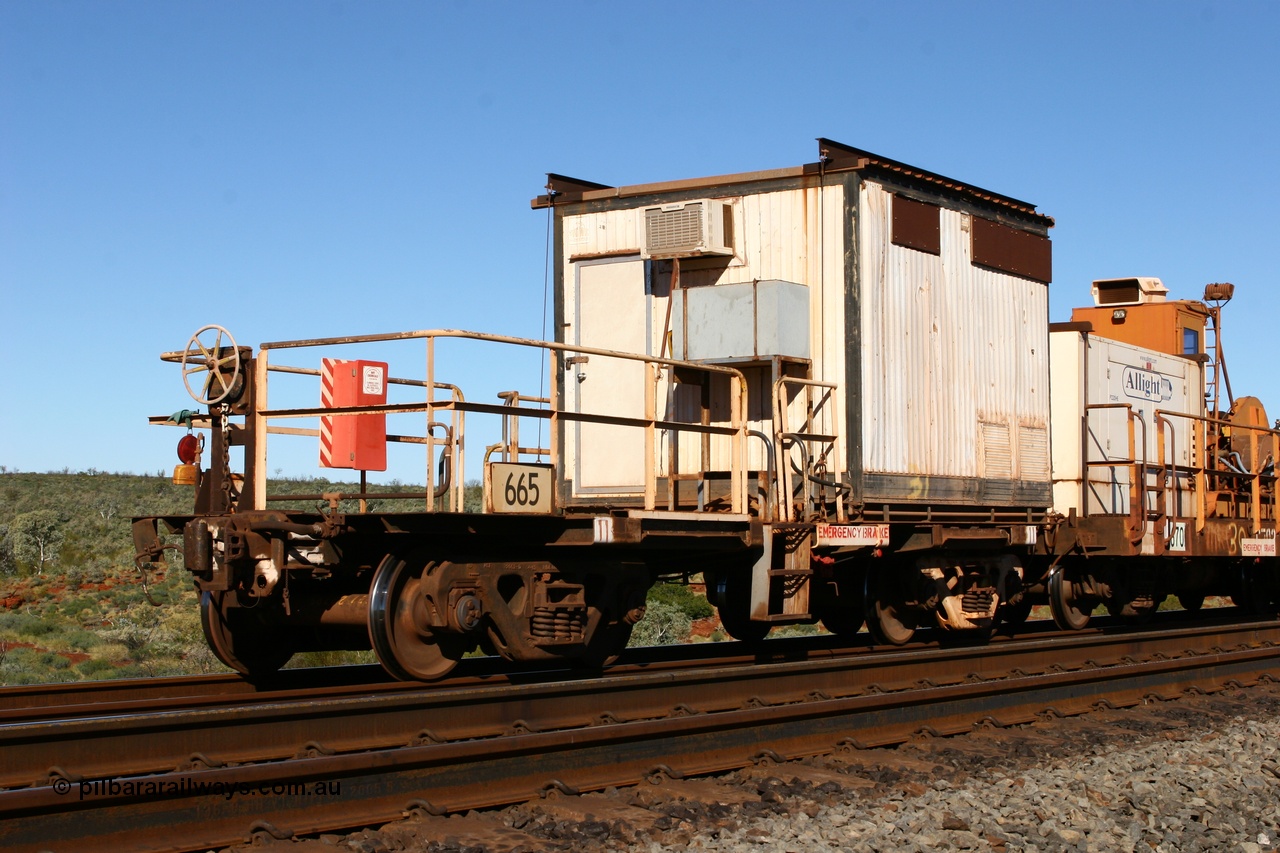060714 6816
Hesta Siding, rail recovery and transport train, flat waggon 665, a cut down Magor USA built former Oroville Dam 91 ton ore waggon, used as the crib waggon on the steel train.
Keywords: Mt-Newman-Mining-WS;Magor-USA;BHP-rail-train;