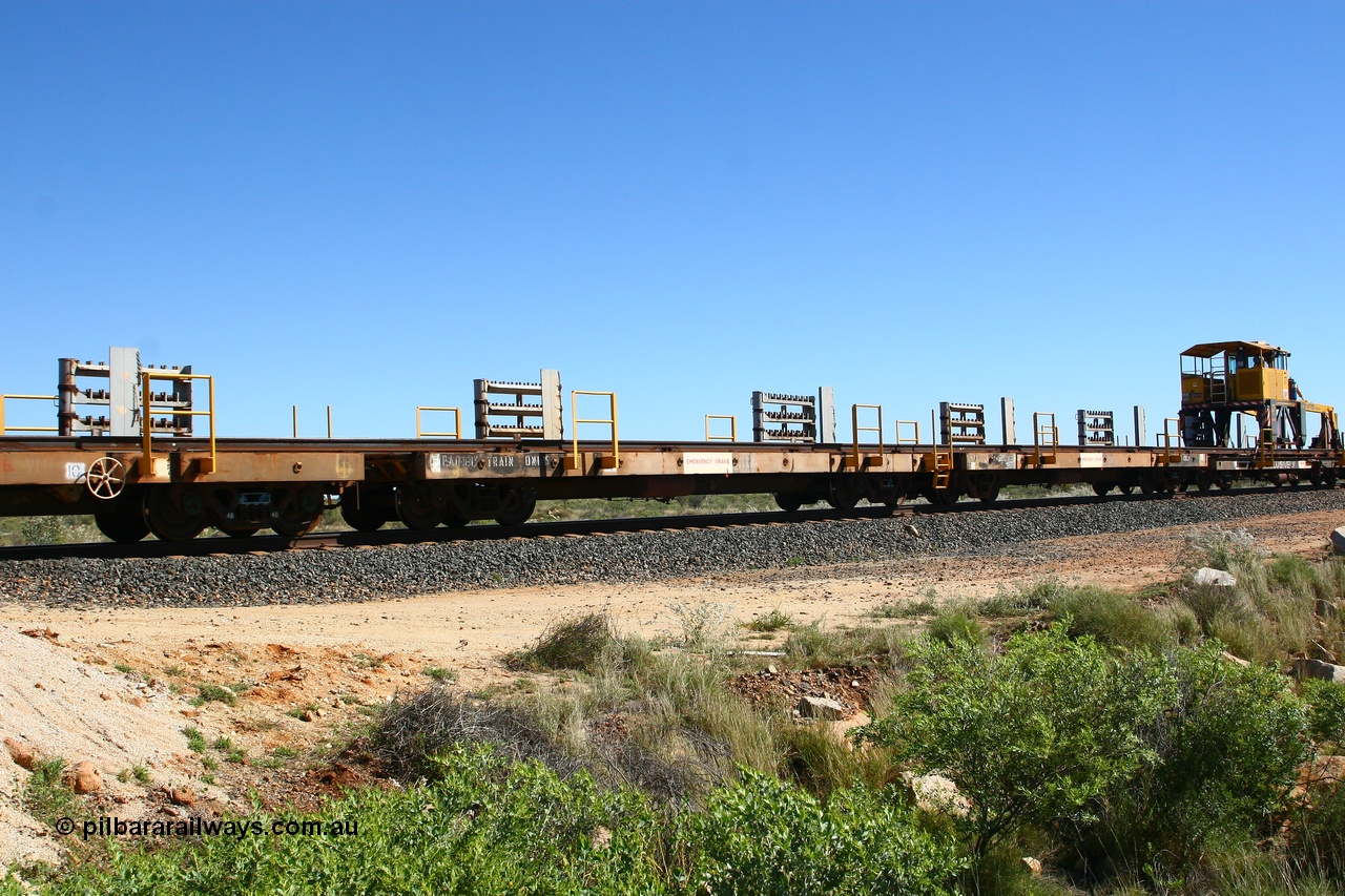 080621 2719
Tabba South, one of a batch of six flat waggons converted by Mt Newman Mining workshops by cutting down a pair of ore waggons to make one flat waggon, 6103 in service with the rail recovery and transport train as waggon #3.
Keywords: Mt-Newman-Mining-WS;Magor-USA;BHP-rail-train;
