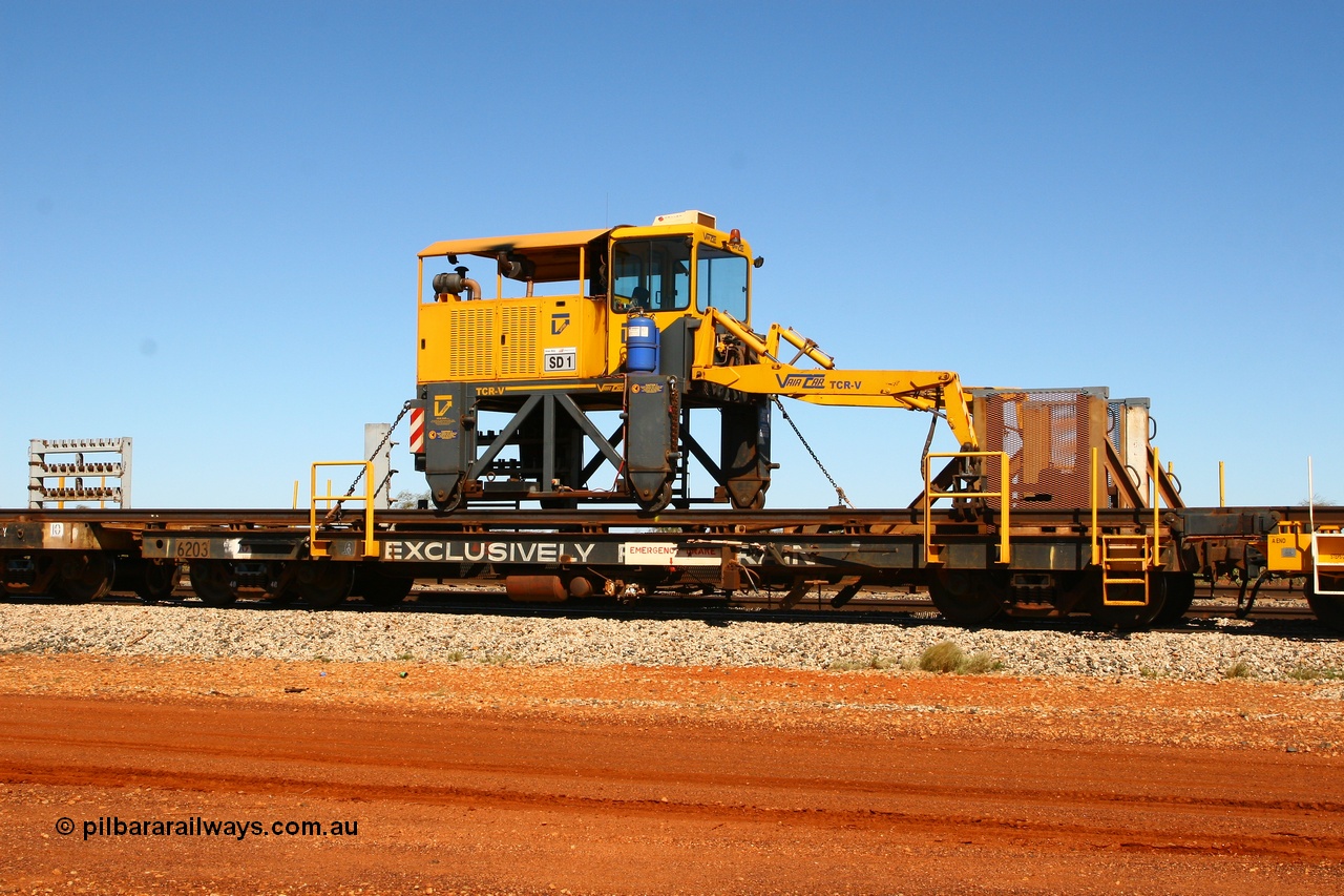 080621 2728
Gillman Siding, rail recovery and transport train flat waggon #1, rear lead off waggon 6203, built by Comeng WA in January 1977. The straddle crane is a newish unit built by Vaia Car model no. TCR-V and the four wheels are chain driven, replacing the original Gemco hydraulic unit.
Keywords: Comeng-WA;BHP-rail-train;