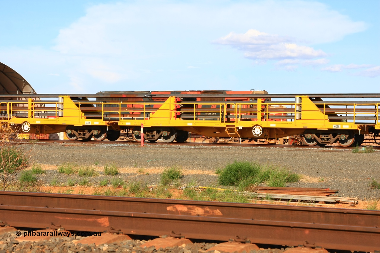 110208 9445
Flash Butt yard, new rail stock carrier waggon 6038 loaded with strings of rail, built by Gemco Rail in late 2009-10 with Barber bogies.
Keywords: BHP-rail-train;Gemco-Rail-WA;