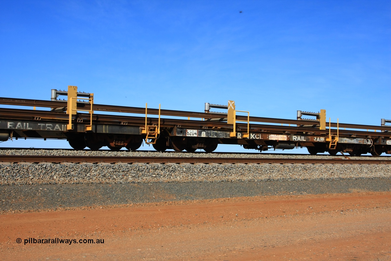 110619 1880
South of Mooka Siding, the Steel Train or rail recovery and transport train, flat waggon #10, 6204, a Comeng WA built flat waggon from January 1977 under order no. 07-M-282 RY.
Keywords: Comeng-WA;BHP-rail-train;