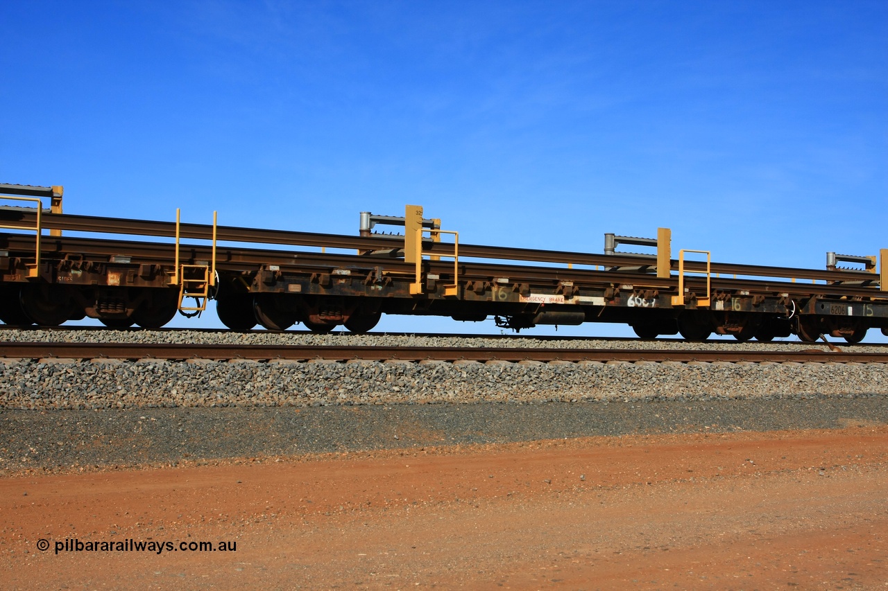 110619 1886
South of Mooka Siding, the Steel Train or rail recovery and transport train, flat waggon #16, 6009, a Scotts of Ipswich Qld built flat waggon from 1970.
Keywords: BHP-rail-train;Scotts-Qld;