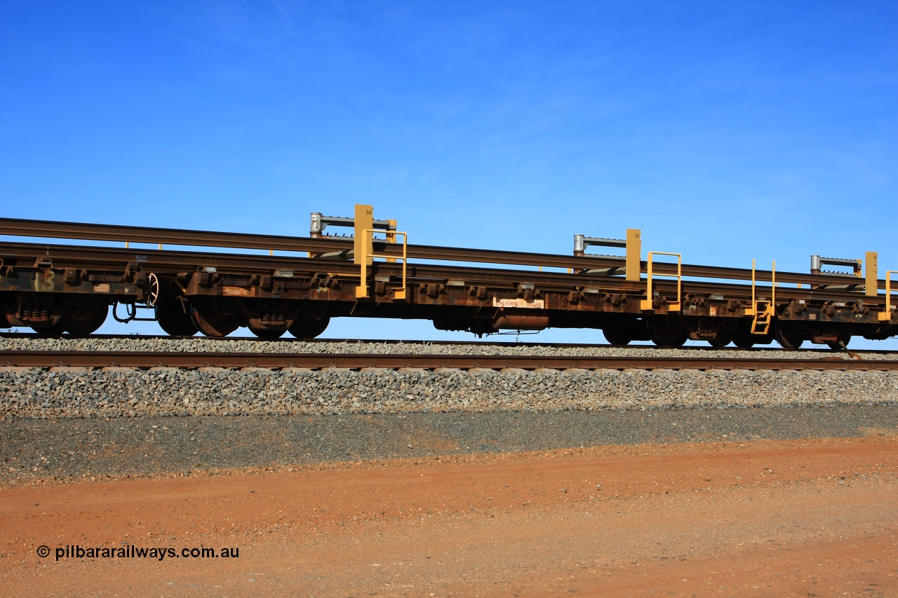110619 1887
South of Mooka Siding, the Steel Train or rail recovery and transport train, flat waggon #17, 6016 with registered number 6506-016, a Comeng WA built flat waggon from 1971.
Keywords: Comeng-WA;BHP-rail-train;