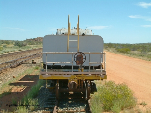 0202 USA 040419 102104
Abydos back track, riveted flat waggon 202 with three water tanks fitted, view of handbrake end, originally part of the 'camp train', modified by Mt Newman Mining railway workshops.
Keywords: BHP-flat-waggon;