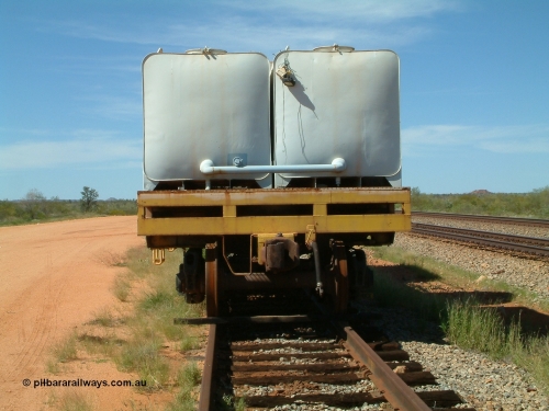 0202 USA 040419 102145
Abydos back track, riveted flat waggon 202 with three water tanks fitted, view of non-handbrake end, originally part of the 'camp train', modified by Mt Newman Mining railway workshops.
Keywords: BHP-flat-waggon;