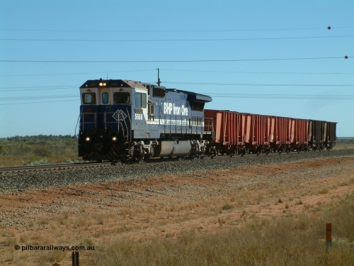 040806 091046
Goldsworthy Junction, 5666 runs the weighbridge test train with the four orange weighbridge test waggons and two ore waggons to provide braking.
