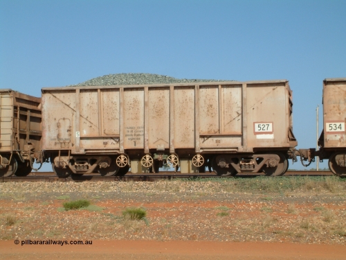 0527 Magor USA 041012 082953
Bing Siding, one of one hundred and forty four original Oroville Dam 91 ton ore waggons built by Magor USA in 1963, sold to Mt Newman Mining in 1968, 527, seen here converted to a ballast car. Note the weld line where the internal plates are for bottom discharge of ballast.
