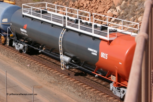 0015 Comeng WA 050315 0235
Redbank Bridge, elevated view of empty 116 kL fuel tanks all built by Comeng in both NSW and WA, 0015 in the Earth livery and 0017 and others in the BHP blue and white livery.
Keywords: Comeng-WA;BHP-tank-waggon;