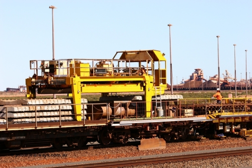 050724 4243
Nelson Point yard, flat waggons in service on the Pony re-laying train as transport waggons for sleepers, with a gantry car sitting atop a heavily modified and cut down Oroville waggon, with the left waggon a Scotts of Ipswich built flat waggon from in 1970 for then Mt Newman Mining Company.
Keywords: Scotts-Qld;BHP-pony-waggon;