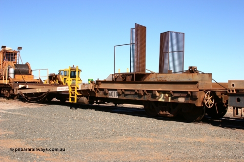 6011 Scotts of Ipswich Qld 050801 4766
Flash Butt yard, rail recovery and transport train, 1st lead off waggon 6011, built by Scotts of Ipswich Qld on 04-09-1970, the mesh guarding is for the winch cable. The chute arrangement for the discharging and recovery of rail is visible.
Keywords: Scotts-Qld;BHP-rail-train;