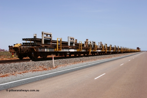051001 5682
Boodarie, the Steel Train or rail recovery and transport train holds the main towards Finucane Island, a loaded rake of Comeng WA and Scotts of Ipswich Qld flat waggons make up the consist.

