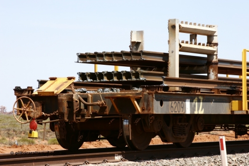 6209 Comeng WA 051001 5683
Boodarie, the Steel Train or rail recovery and transport train, hand brake end of waggon #12, 6209, a Comeng WA built flat waggon from January 1977 under order no. 07-M-282 RY.
Keywords: Comeng-WA;BHP-rail-train;