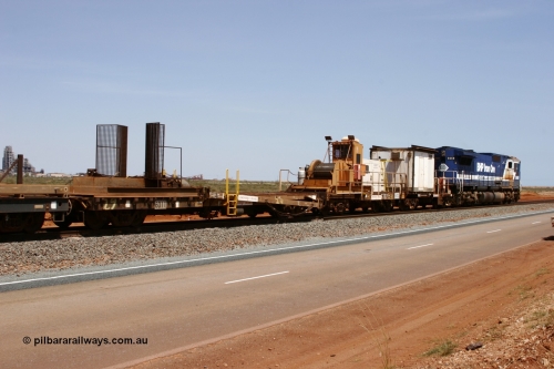 6011 Scotts of Ipswich Qld 051001 5725
Boodarie, the Steel Train or rail recovery and transport train, 1st lead off waggon 6011, built by Scotts of Ipswich 04-09-1970, the mesh guarding is for the winch cable. The chute arrangement for the discharging and recovery of rail is visible. Then 6702 winch waggon and 665 the crib waggon.
Keywords: Scotts-Qld;BHP-rail-train;