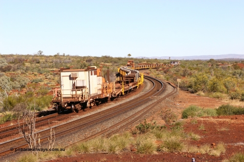 0665 Mt Newman Mining Workshops 060714 6813
Hesta Siding, view from the rear of the rail recovery and transport train as it snakes around the curves. Crib waggon 665 a former Magor USA built ore waggon, heavily modified by Mt Newman Mining workshops and fitted with an ATCO donga.
Keywords: Mt-Newman-Mining-WS;Magor-USA;BHP-rail-train;