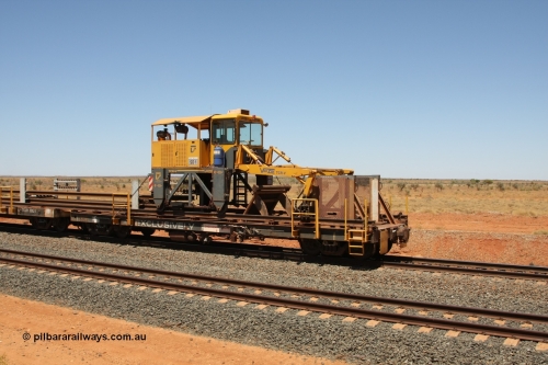 6203 Comeng WA 081217 0457
Woodstock Siding, rail recovery and transport train flat waggon #1, rear lead off waggon 6203, built by Comeng WA in January 1977 under order number 07-M-282 RY. The straddle crane is a newish unit built by Vaia Car model no. TCR-V and the four wheels are chain driven, replacing the original Gemco hydraulic unit.
Keywords: Comeng-WA;BHP-rail-train;