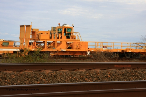 6047 Gemco WA 100717 0688
Flash Butt yard, new rail winch waggon 6047 obstructed by scrub, view from A end showing rail ramps, built by Gemco Rail in late 2009-10 with Barber bogies.
Keywords: Gemco-Rail-WA;BHP-rail-train;