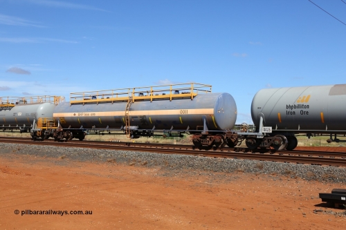 0011 Comeng NSW 150314 7745
Bing Siding, empty 116 kL Comeng NSW built tank waggon 0011 from 1972, one of three such tank waggons.
Keywords: Comeng-NSW;BHP-tank-waggon;