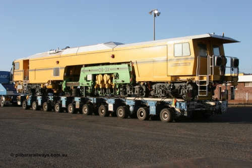 050409 0404
Shell Swagman Roadhouse, rear view of Lampson eighty wheel float ready to deliver BHP's new mainline tamper a Plasser Australia 09-3X model with serial M480. 9th April 2005.
Keywords: Tamper3;Plasser-Australia;09-3X;M480;track-machine;
