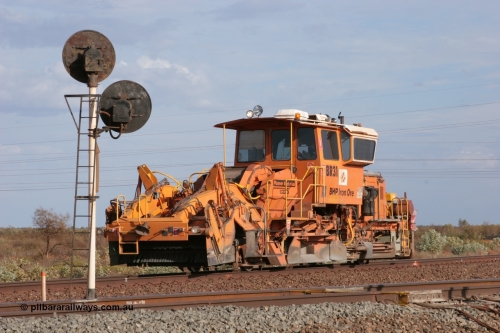 050411 0597
Goldsworthy Junction, BHP track machine ballast regulator BR 31 a Plasser Australia SSP 110SW model with serial 401 comes off the former Goldsworthy line at signal GJ 9 which has two heads due to the curve of the line. 11th April 2005.
Keywords: BR31;Plasser-Australia;SSP-110SW;401;track-machine;
