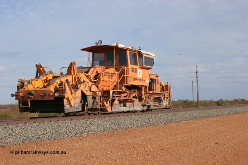 050411 0611
Goldsworthy Junction, BHP track machine ballast regulator BR 31 a Plasser Australia SSP 110SW model with serial 401 runs along the Newman mainline towards Bing Siding. 11th April 2005.
Keywords: BR31;Plasser-Australia;SSP-110SW;401;track-machine;