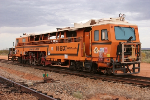 050412 0820
Abydos Siding backtrack, front view of BHP's Mainline Tamper 1, a Plasser Australia 09-32 CAT model tamper serial 306 built in 1986. 12th April 2005.
Keywords: Tamper1;Plasser-Australia;09-32-CAT;306;track-machine;