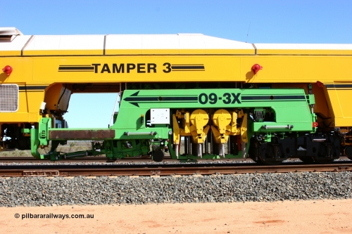 050625 3661
Mooka North, BHP's new Tamper 3 track machine a Plasser Australia 09-3X model serial M480 in out on the passing track, view of the tamping heads and mechanism. 25th June 2005.
Keywords: Tamper3;Plasser-Australia;09-3X;M480;track-machine;