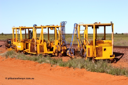 050625 3813
Node 2 at the 38 km on the GML or former Goldsworthy mainline, three Barclay Mowlem sleeper inserter track machines off clear of the running lines. 25th June 2005.
Keywords: track-machine;