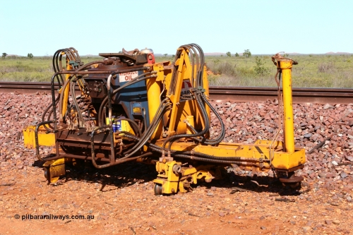 050625 3817
Node 2 at the 38 km on the GML or former Goldsworthy mainline, a Barclay Mowlem track lifter track machine off clear of the running lines. 25th June 2005.
Keywords: track-machine;