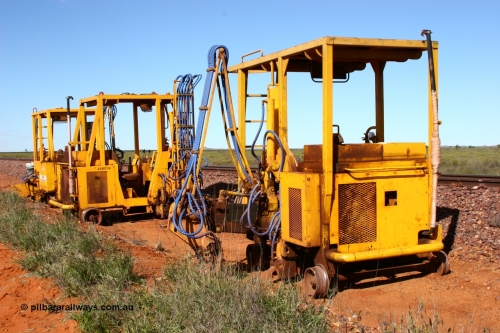 050625 3818
Node 2 at the 38 km on the GML or former Goldsworthy mainline, three Barclay Mowlem sleeper inserter track machines off clear of the running lines. 25th June 2005.
Keywords: track-machine;