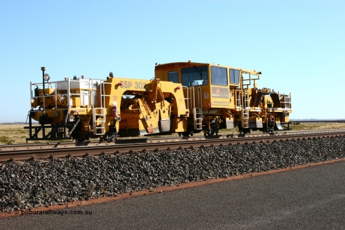 060710 6229
At the Broome Rd grade crossing Port Hedland, track machine BR 33 a Plasser Australia ballast regulator model SSP 302 serial M486. 10th July 2006.
Keywords: BR33;Plasser-Australia;SSP-302;M486;track-machine;