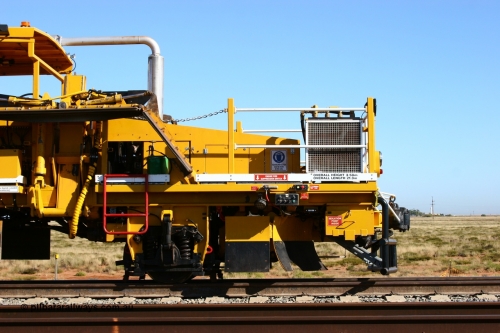 060710 6238
At the Broome Rd grade crossing Port Hedland, track machine BR 33 a Plasser Australia ballast regulator model SSP 302 serial M486. 10th July 2006.
Keywords: BR33;Plasser-Australia;SSP-302;M486;track-machine;