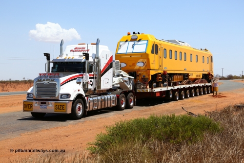 151206 9653
Boodarie, parked up in a parking bay just out of town on a Sunday awaiting delivery on the following day, behind a Gavin Transport Mack Titan 600 on a Drake float, BHP's new track recording vehicle which is a Mermec ROGER 800 imported from Italy. ROGER is an acronym for Rilievo Ottico Geometria Rotaia, Italian for optical rail geometry control.
Keywords: MM800;Mermec-Italy;Roger-800;track-machine;Mack;Titan;