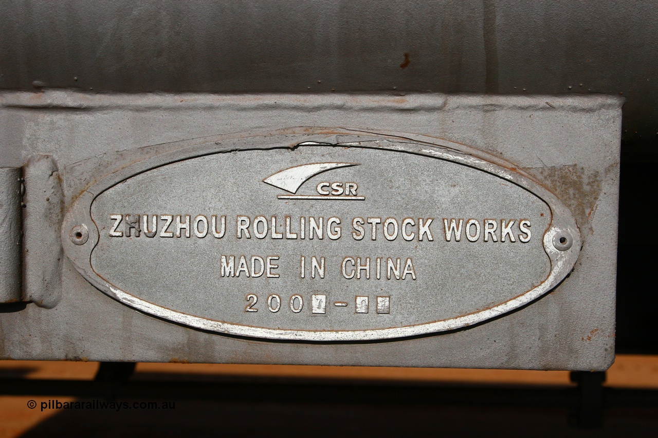 080116 1378
Chapman Siding, FMG slave waggon 1187, built by CSR at their Zhuzhou Rolling Stock Works in China during August 2007, view of the builders plate. 16th January 2008.
Keywords: 1187;CSR-Zhuzhou-Rolling-Stock-Works-China;FMG-ore-waggon;