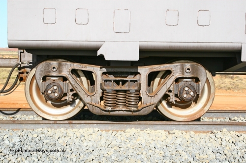 02372 080116 1380
Chapman Siding 69 km, the Zhuzhou Rolling Stock Works cast bogie underneath FMG master waggon 2372, bogie has a cast date of 08-07 for August 2007 and is riding on Timken AP Glass G 7 x 17 bearings. 16th January 2008.
Keywords: 2372;CSR-Zhuzhou-Rolling-Stock-Works-China;FMG-ore-waggon;