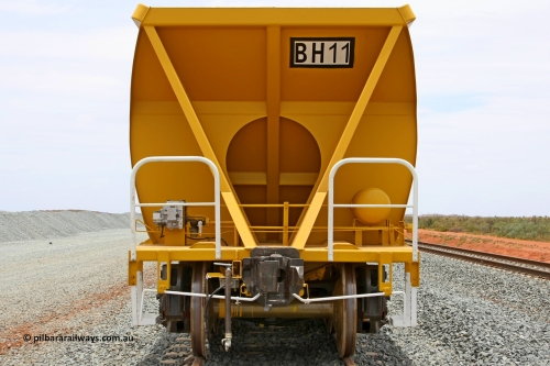 BH 11 081225 0566
Barker Siding, one of FMG's thirty five ballast waggons, BH 11, non-handbrake end view, 100 tonne capacity, built in China by CSR at the Yangtze Rolling Stock Company in 2008. December 25, 2008.
Keywords: BH11;CSR-Yangtze-Rolling-Stock-Co-China;FMG-ballast-waggon;